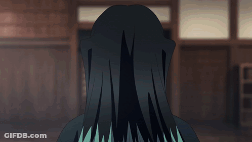 A Person With Long Black Hair And Blue Eyes GIF