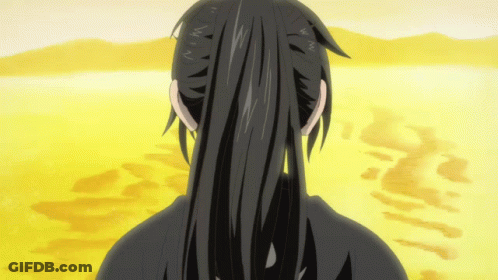 A Person With Long Black Hair Is Standing In A Desert GIF