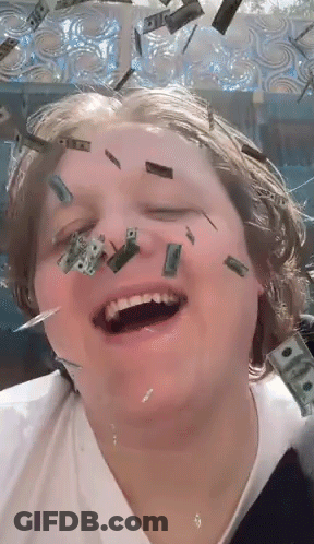 A Person With Money Falling On Their Face And One Dollar Bills On Their Face GIF