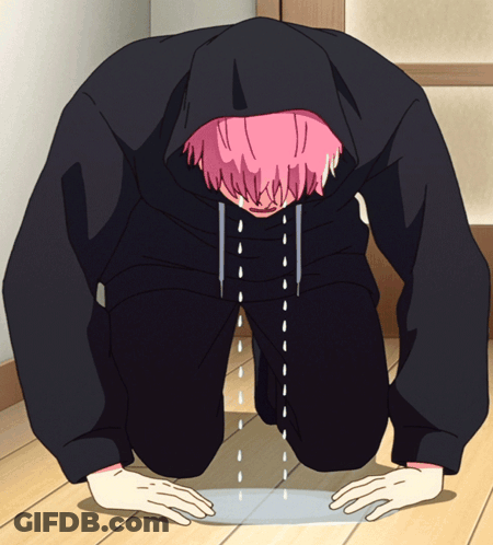 A Person With Pink Hair And A Black Hoodie Is Kneeling Down GIF