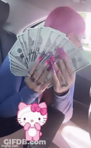 A Person With Pink Hair Is Holding A Bunch Of Money In Front Of A Hello Kitty . GIF