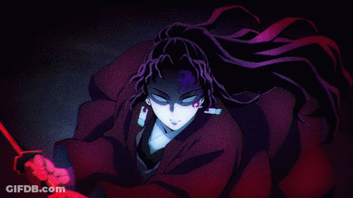 A Person With Purple Hair Is Standing In A Dark Room With A Red Object In Front Of Them GIF