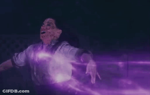 A Person With Purple Smoke Coming Out Of Their Mouth GIF