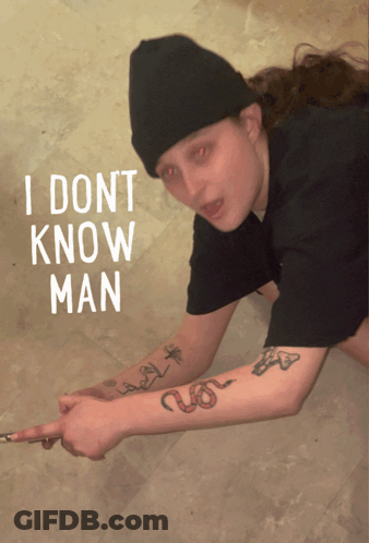 A Person With Red Eyes And A Tattoo On Their Arm Says " I Dont Know Man " In White Letters GIF