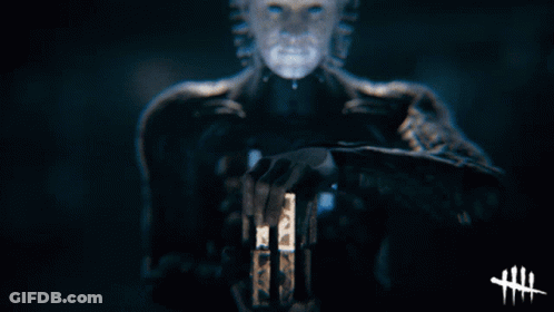 A Person With Spikes On Their Head Is Holding A Glowing Object GIF