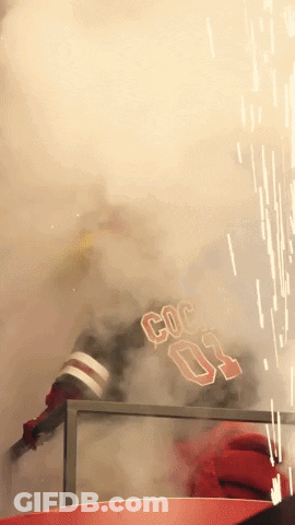 A Person With The Number 03 On Their Jersey Is Surrounded By Smoke GIF