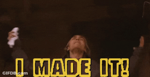 A Person With Their Arms Outstretched And The Words I Made It Behind Them GIF