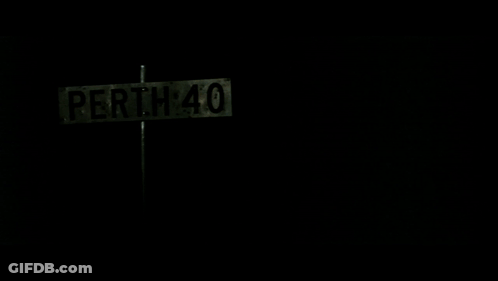 A Perth 40 Street Sign In The Dark GIF