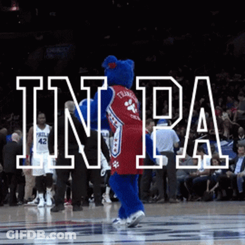 A Philadelphia 76Ers Mascot Dancing On A Basketball Court GIF