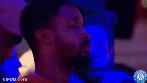 A Philadelphia Basketball Game Is Being Played In Front Of A Scoreboard GIF