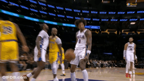 A Philadelphia Basketball Player Dribbles A Ball During A Game GIF