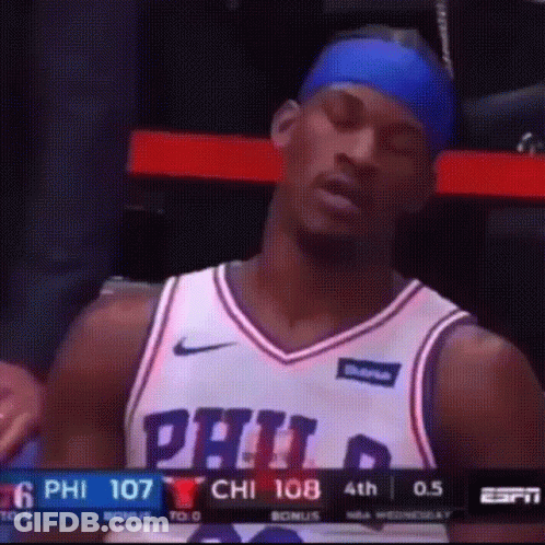 A Philadelphia Basketball Player Is Sitting In The Stands GIF