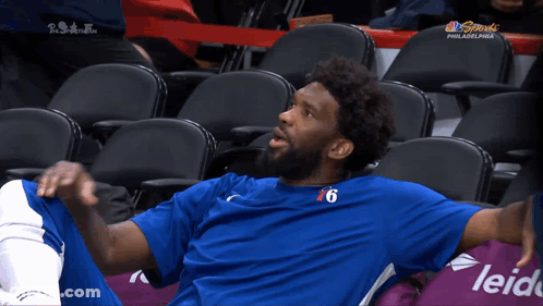 A Philadelphia Basketball Player Sits In The Stands GIF