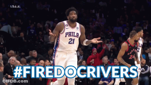 A Philadelphia Basketball Player Stands In Front Of A Crowd During A Game GIF