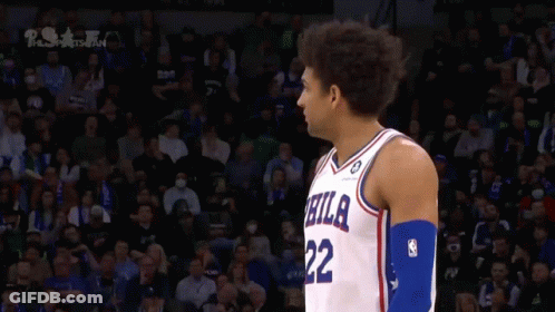 A Philadelphia Basketball Player Stands In Front Of The Crowd GIF