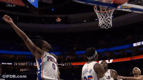 A Philadelphia Basketball Player Throws The Ball In The Net GIF