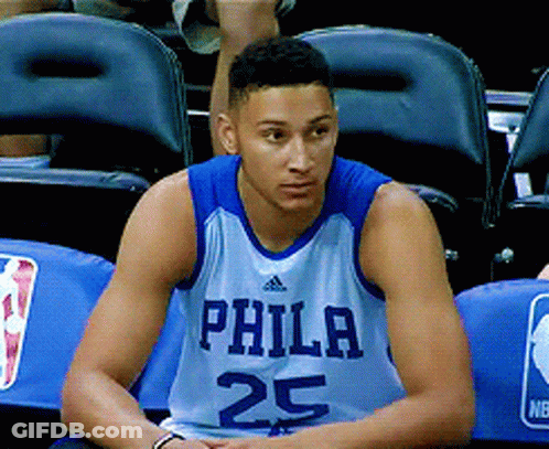 A Philadelphia Basketball Player Wearing Number 25 Sits In The Stands GIF