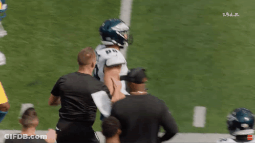 A Philadelphia Eagles Football Player Stands On The Field GIF