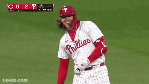 A Phillies Baseball Player Celebrates A Home Run During A Game GIF