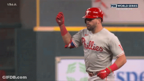 A Phillies Baseball Player Is Celebrating A Home Run GIF