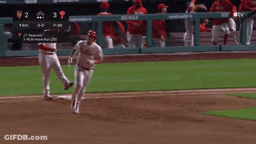 A Phillies Baseball Player Is Running Towards The Base GIF
