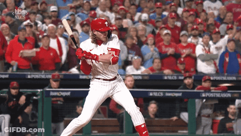 A Phillies Baseball Player Swings His Bat At The Ball GIF