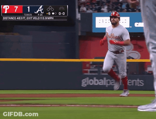 A Phillies Player Runs To First Base During A Game GIF