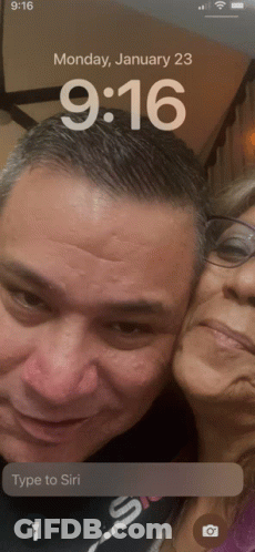 A Phone Screen Shows A Man And A Woman On Monday January 23 GIF