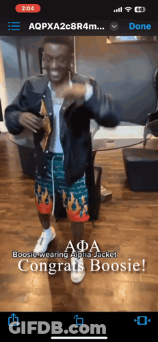 A Phone Screen Shows A Man Wearing A Jacket And Shorts And Says Boosie Wearing Alpha Jacket Congrats Boosie GIF