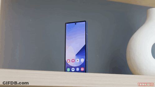 A Phone Sitting On A Shelf With The Words Thinkjules Below It GIF