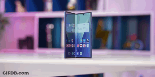 A Phone With A Purple Background Shows The Time As 8:20 GIF