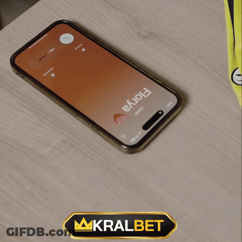 A Phone With A Time Of 19:56 On The Screen GIF