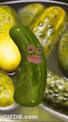 A Pickle With A Face On It Is Surrounded By Other Pickles GIF