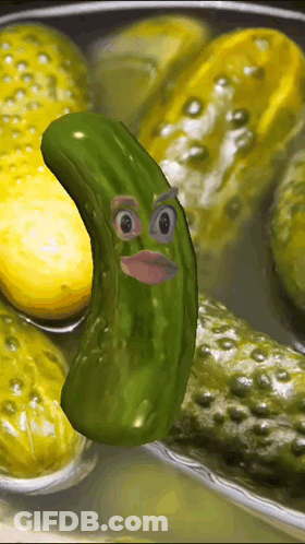 A Pickle With A Face On It Is Surrounded By Pickles GIF