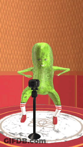 A Pickle With A Microphone In Front Of It GIF