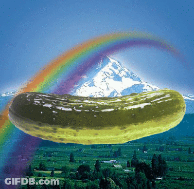 A Pickle With A Mountain And Rainbow In The Background GIF