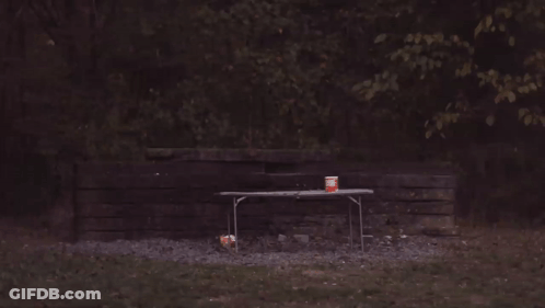 A Picnic Table With A Can Of Soda On It That Is On Fire GIF