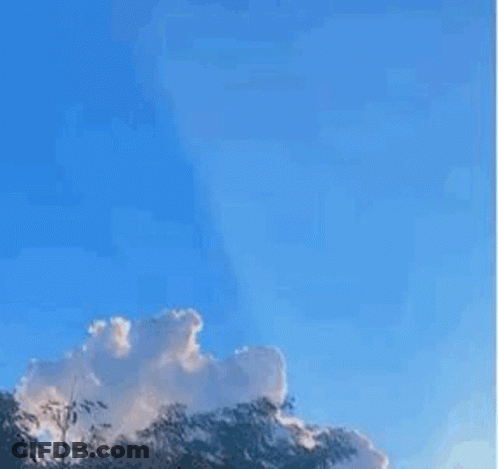 A Picture Of A Blue Sky With A Tree In The Foreground And A Quote In The Middle . GIF