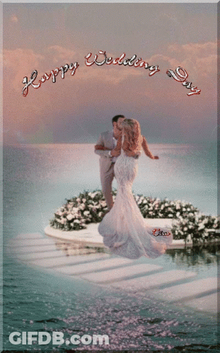 A Picture Of A Bride And Groom With The Words Happy Wedding Day GIF