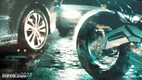 A Picture Of A Car And A Motorcycle With The Number Cravello2023 On The Bottom GIF