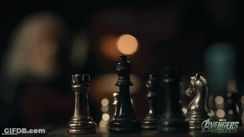 A Picture Of A Chess Board With The Words Avengers On It GIF