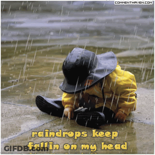 A Picture Of A Child In The Rain With The Words Raindrops Keep Fallin On My Head GIF