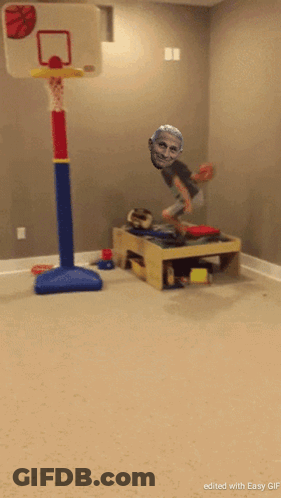 A Picture Of A Child Jumping In The Air With A Basketball Hoop In The Background GIF