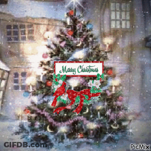 A Picture Of A Christmas Tree With A Merry Christmas Sign Above It GIF