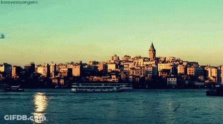A Picture Of A City With A Boat In The Foreground And The Words Bosahayasayange On The Bottom GIF