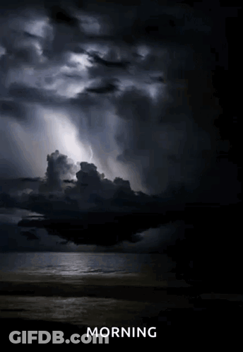 A Picture Of A Cloudy Sky Over A Body Of Water With The Word Morning Below It GIF