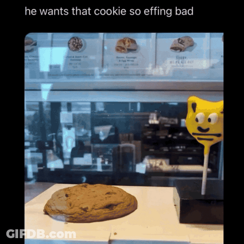 A Picture Of A Cookie Next To A Lollipop That Says He Wants That Cookie So Effing Bad GIF