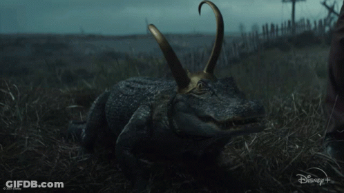 A Picture Of A Crocodile With A Disney Logo In The Background GIF