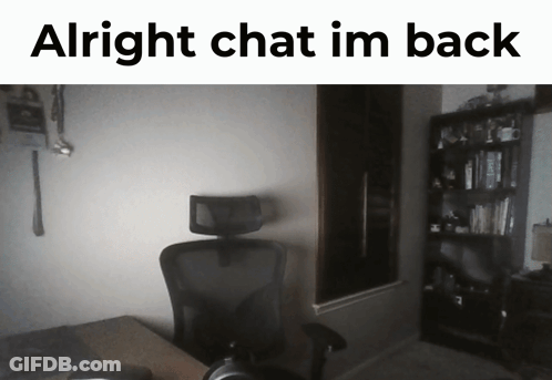 A Picture Of A Dark Room With The Words Alright Chat Im Back Above It GIF