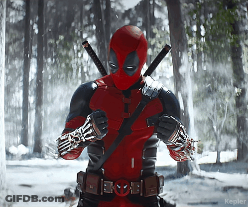 A Picture Of A Deadpool Standing In The Snow GIF